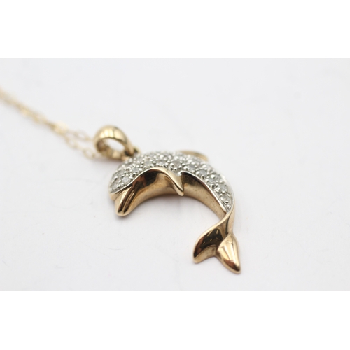 7 - 9ct gold diamond dolphin pendant necklace (2.7g)