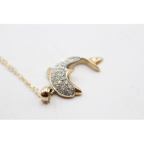 7 - 9ct gold diamond dolphin pendant necklace (2.7g)