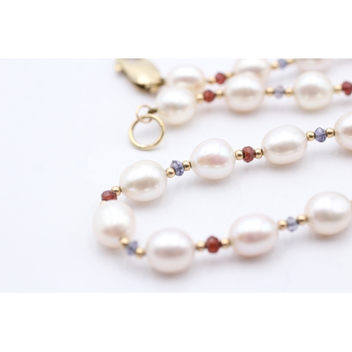 8 - 9ct gold cultured pearl, ruby & sapphire necklace (37g)