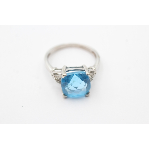 102 - 9ct white gold blue gemstone set cocktail ring (3.2g) Size O