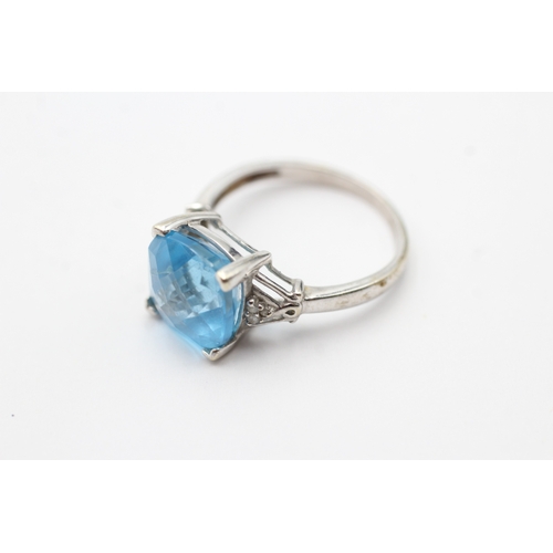 102 - 9ct white gold blue gemstone set cocktail ring (3.2g) Size O