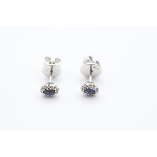 103 - 18ct gold sapphire & diamond halo stud earrings (2.5g)