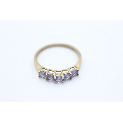 110 - 9ct gold tanzanite five stone ring, claw set (1.6g) Size P