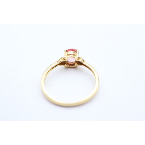 144 - 18ct gold oval cut enhanced padparadscha sapphire solitaire ring (2.1g) Size O