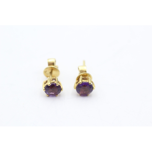 147 - 14ct gold amethyst stud earrings (2.3g)