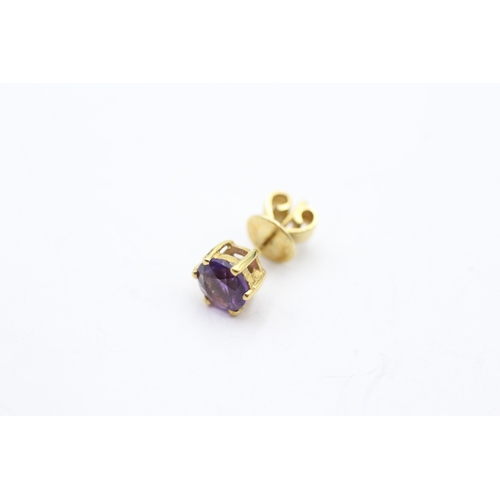 147 - 14ct gold amethyst stud earrings (2.3g)