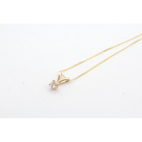 153 - 14ct gold diamond solitaire pendant on a 9ct gold chain (0.6g)