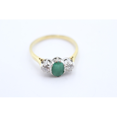 161 - 18ct gold diamond and emerald set trilogy ring (3.7g) Size R