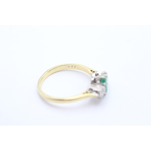 161 - 18ct gold diamond and emerald set trilogy ring (3.7g) Size R