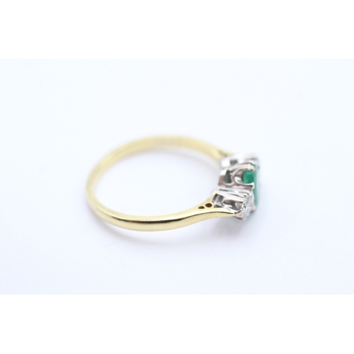 161 - 18ct gold diamond and emerald set trilogy ring (3.7g) Size R