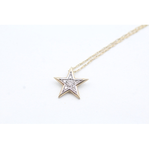 163 - 9ct gold diamond star pendant necklace (1.5g)