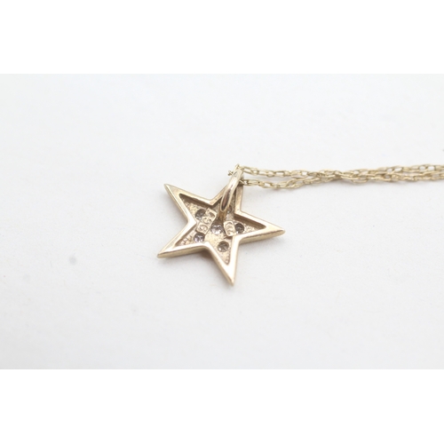 163 - 9ct gold diamond star pendant necklace (1.5g)