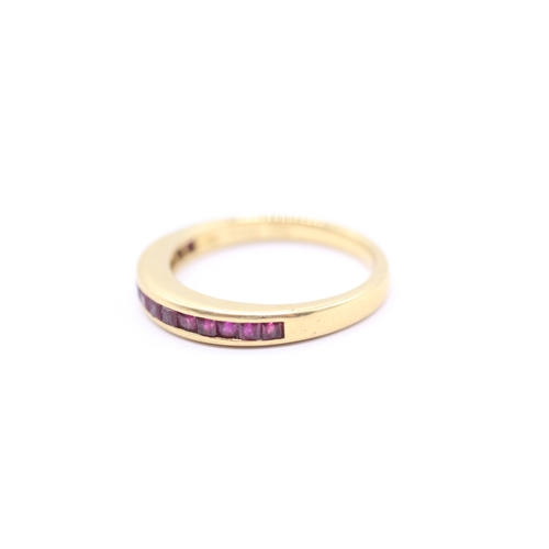 166 - 18ct gold ruby half eternity ring (4g) Size N