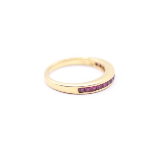 166 - 18ct gold ruby half eternity ring (4g) Size N