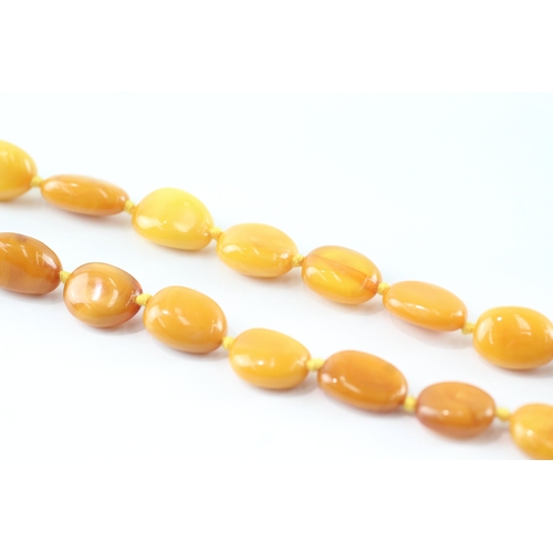 191 - 9ct gold clasped amber necklace (39g)