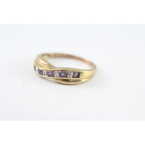 194 - 9ct gold amethyst & diamond cross-over ring (1.9g) Size P