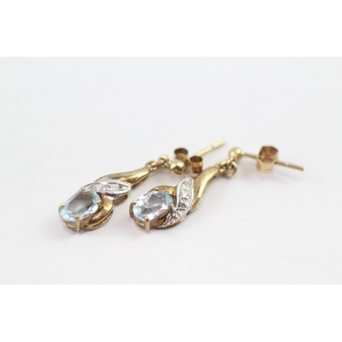 196 - 9ct gold diamond and topaz twist drop earrings (1.6g)