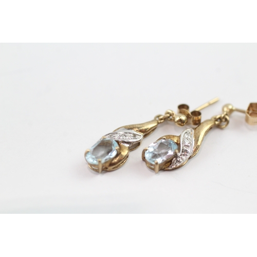 196 - 9ct gold diamond and topaz twist drop earrings (1.6g)