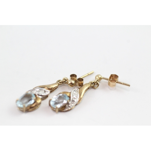 196 - 9ct gold diamond and topaz twist drop earrings (1.6g)