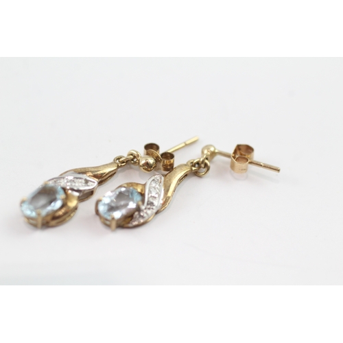 196 - 9ct gold diamond and topaz twist drop earrings (1.6g)