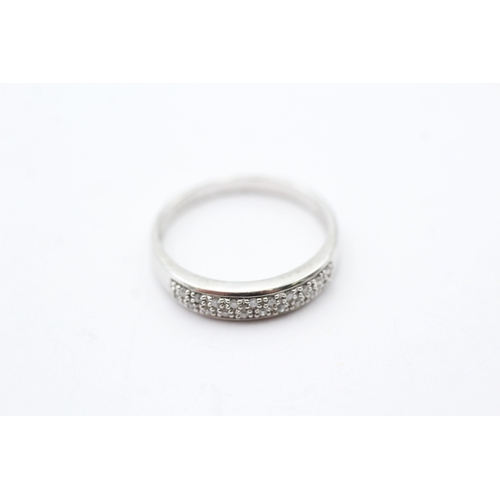 44 - 9ct white gold diamond two row half eternity ring (2.2g) Size P