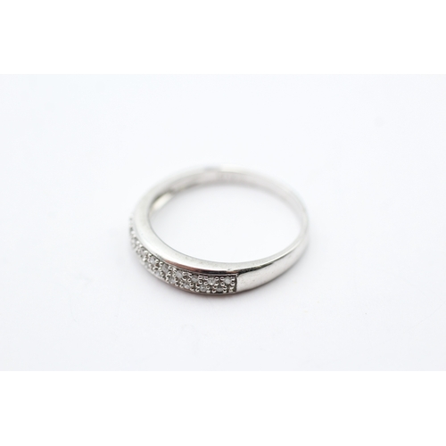 44 - 9ct white gold diamond two row half eternity ring (2.2g) Size P