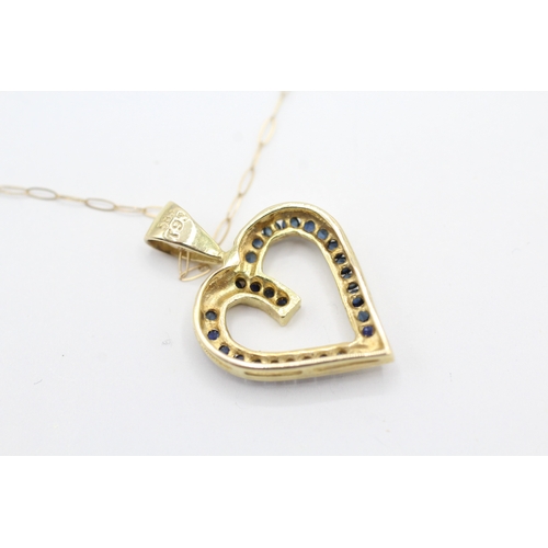 56 - 14ct gold sapphire heart shape pendant with a 9ct gold chain (2g)