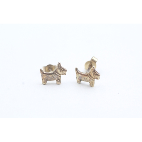 62 - 9ct gold dog stud earrings (1g)