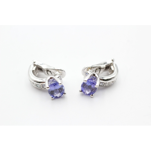 64 - 18ct white gold tanzanite and diamond set clip-on earrings (8.3g)