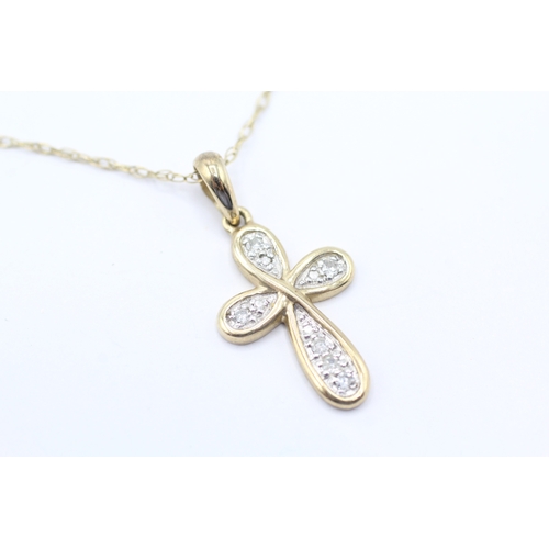 66 - 9ct gold diamond cross pendant necklace (1.8g)