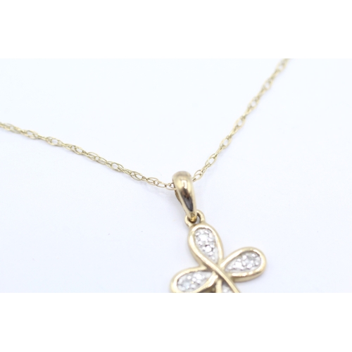 66 - 9ct gold diamond cross pendant necklace (1.8g)