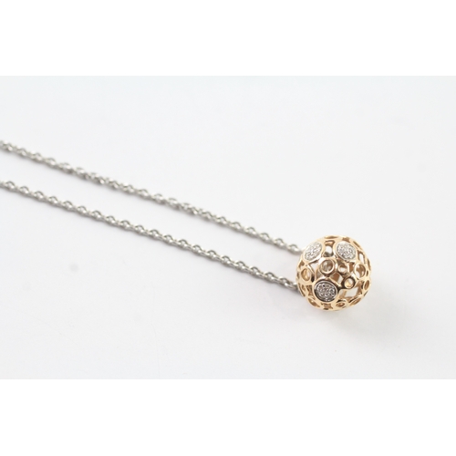 71 - 18ct gold diamond open work pendant on chain (6.8g)