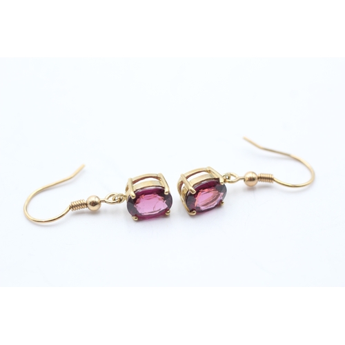 97 - 9ct gold oval cut purple garnet drop earrings with French hooks (2.9g)