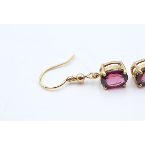 97 - 9ct gold oval cut purple garnet drop earrings with French hooks (2.9g)