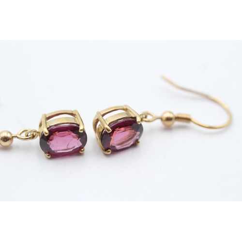 97 - 9ct gold oval cut purple garnet drop earrings with French hooks (2.9g)