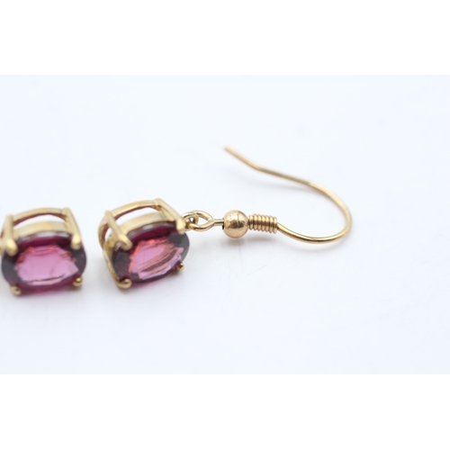 97 - 9ct gold oval cut purple garnet drop earrings with French hooks (2.9g)