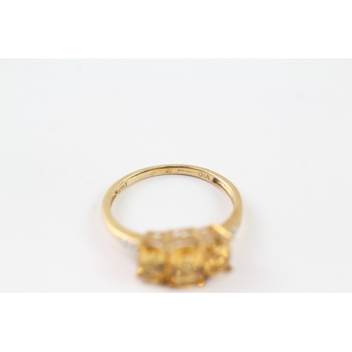 105 - 9ct gold diamond and citrine trilogy ring (2.2g) Size Q