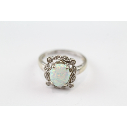 106 - 9ct gold opal and diamond ornate halo ring (2.9g) Size N 1/2