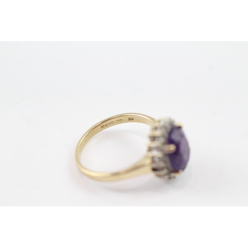 109 - 9ct gold amethyst and diamond halo ring (3g) Size M