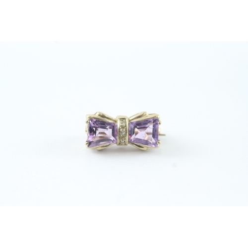 117 - 9ct gold amethyst & diamond bow brooch (2.4g)