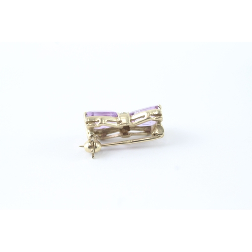 117 - 9ct gold amethyst & diamond bow brooch (2.4g)