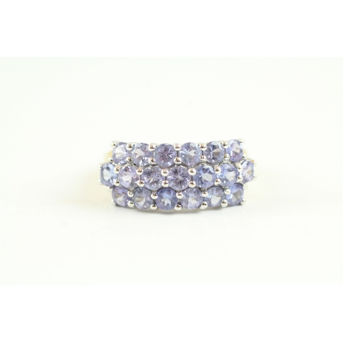 138 - 9ct gold tanzanite cluster dress ring (2.9g) Size M