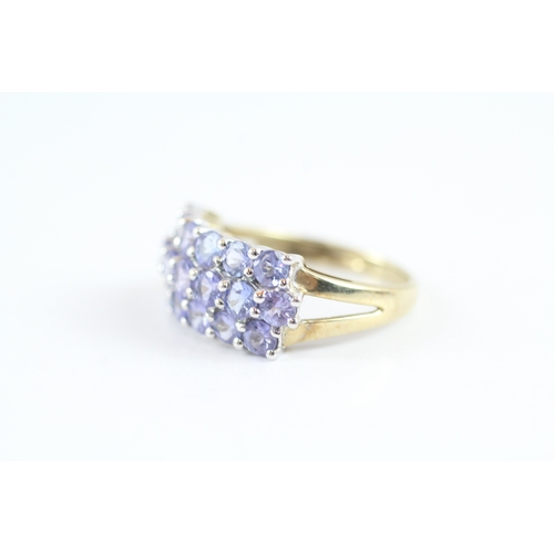 138 - 9ct gold tanzanite cluster dress ring (2.9g) Size M