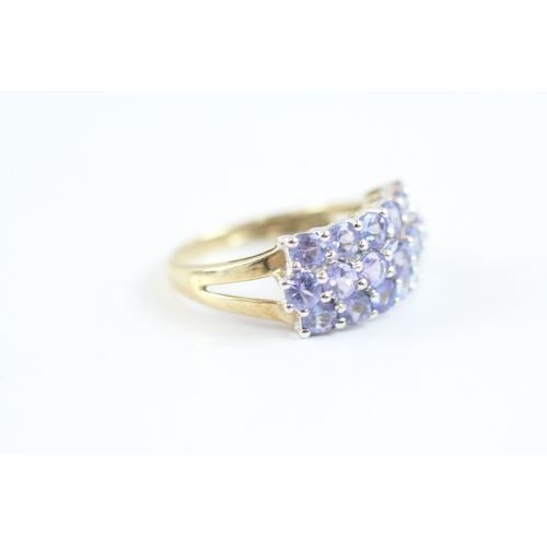 138 - 9ct gold tanzanite cluster dress ring (2.9g) Size M