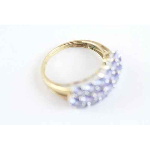 138 - 9ct gold tanzanite cluster dress ring (2.9g) Size M