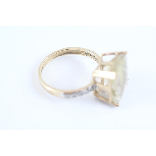 139 - 9ct gold claw set rutile quartz & diamond shoulder dress ring (3g) Size K