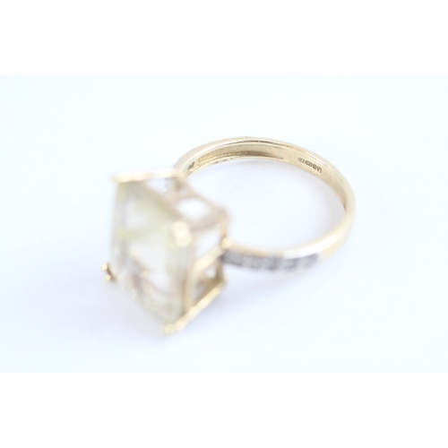 139 - 9ct gold claw set rutile quartz & diamond shoulder dress ring (3g) Size K