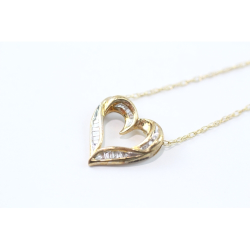 140 - 9ct gold baguette cut diamond heart shape pendant necklace (2.4g)