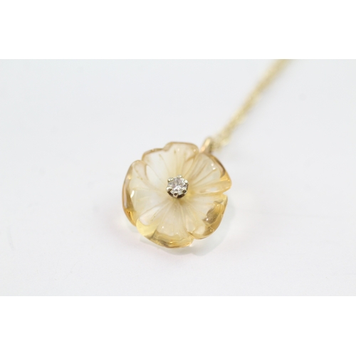 181 - 9ct gold citrine and diamond carved flower pendant on chain (2g)