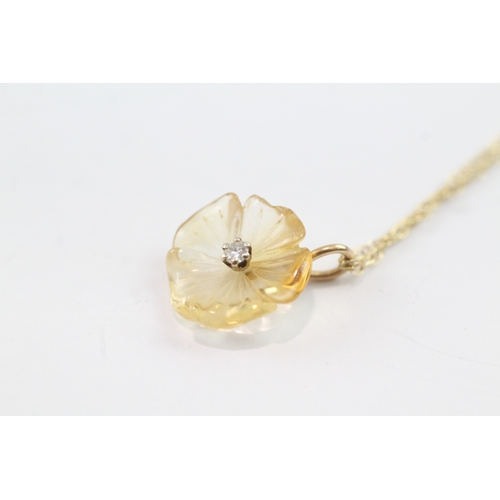 181 - 9ct gold citrine and diamond carved flower pendant on chain (2g)